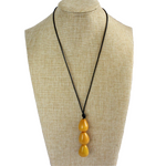 Necklace, handmade, sustainable tagua nut, mustard, stand