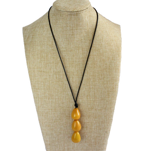 Necklace, handmade, sustainable tagua nut, mustard, stand