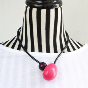 Handmade necklace, tagua nut, sustainable, magnet, pink, stand