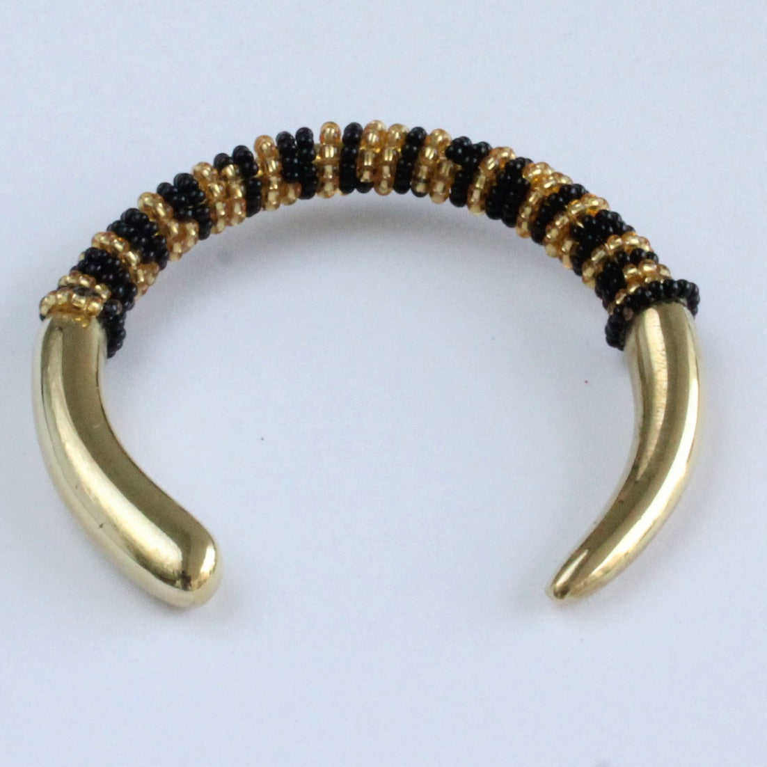 African handmade brass bracelet with black and gold beads