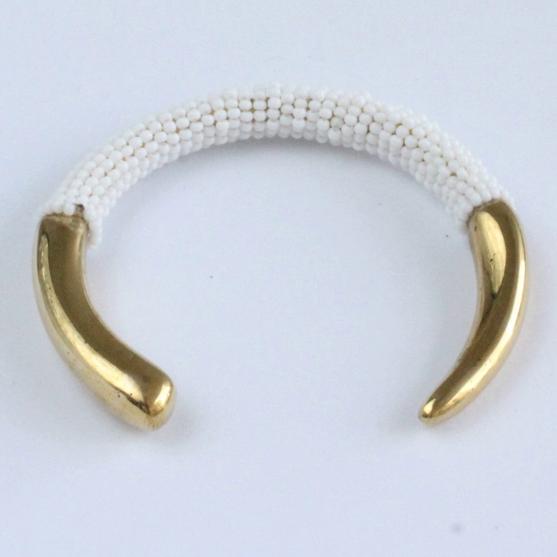 African handmade brass bracelet with white beads