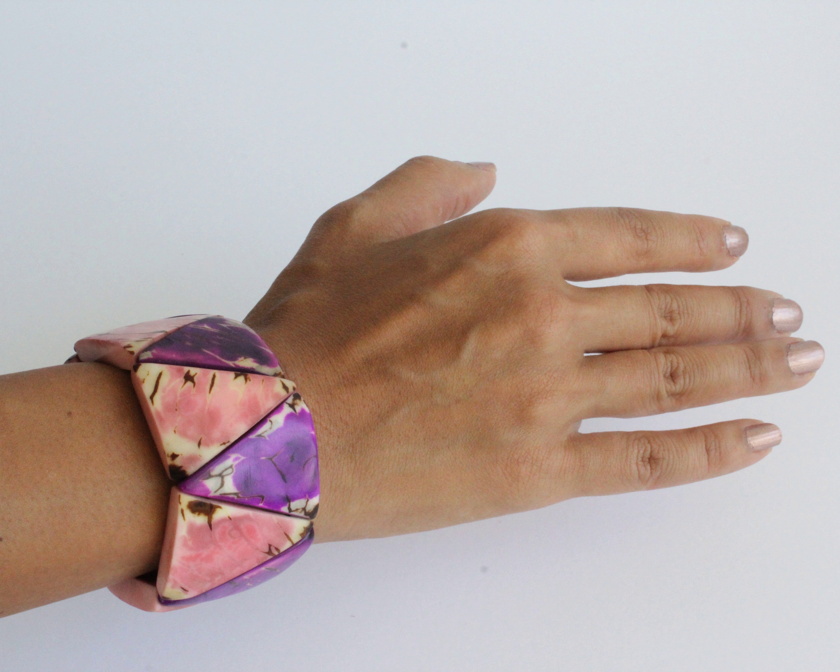 Handmade bracelet on arm, tagua nut, purple