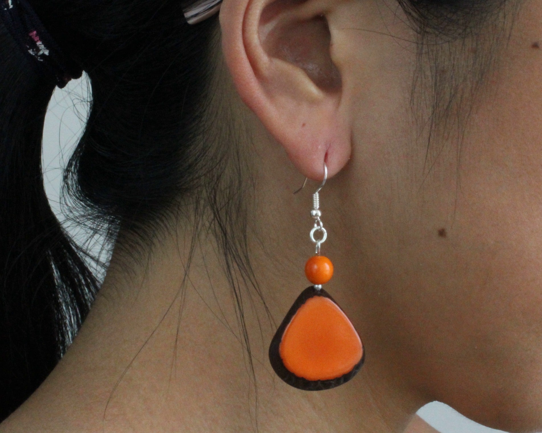 Handmade earring, fish hook, tagua, colourful, orange, ear