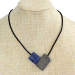 Handmade necklace, sustainable, tagua nut, magnetic lock, blue grey, stand
